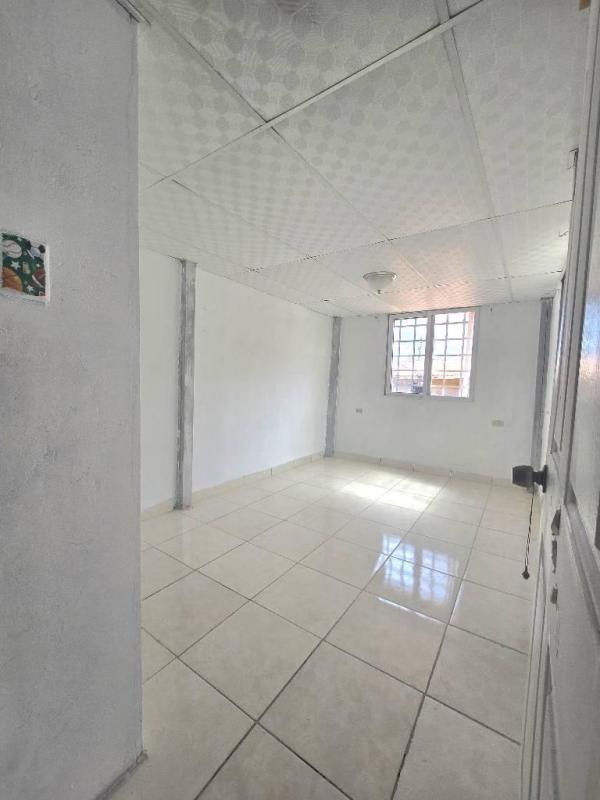 Spacious bedroom with security barred window in Condado del Rey house for sale
