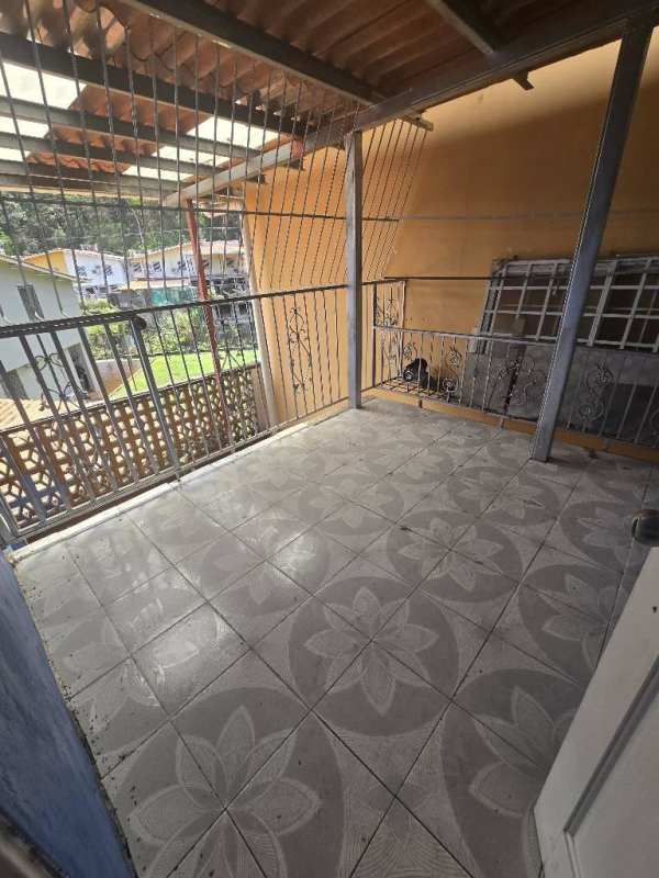 Covered balcony with decorative tiles and safety grills in Condado del Rey duplex