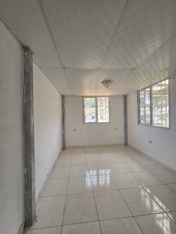 Large empty room with tiled floor in Condado del Rey duplex for sale Panama City