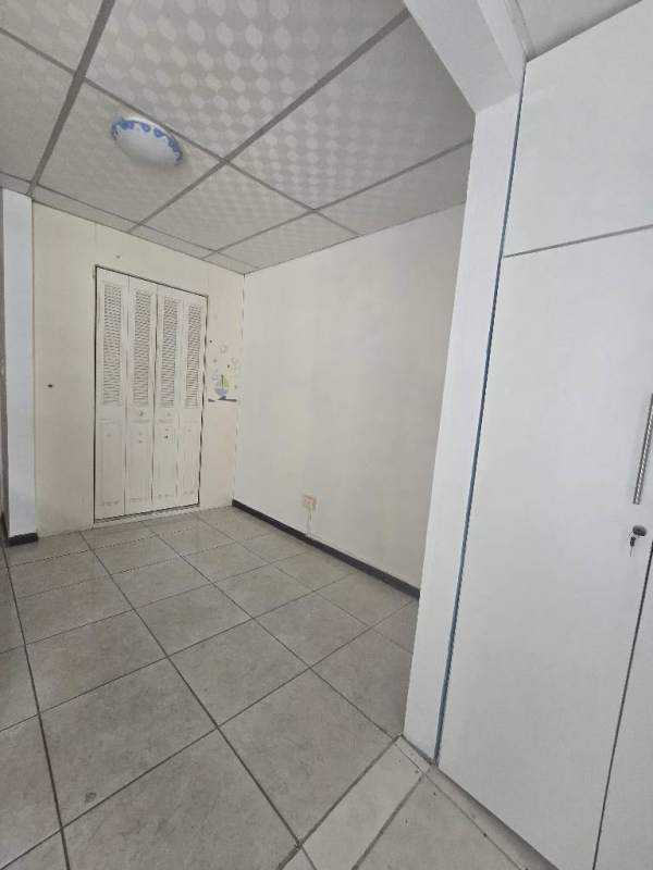 Bedroom in duplex home Condado del Rey with white closet doors in Panama property for sale