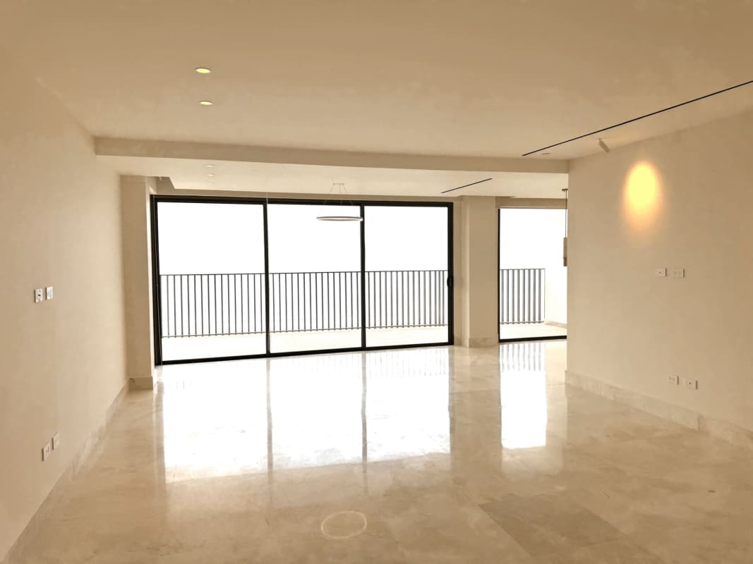 Elegant master bedroom featuring large windows and ocean panorama in luxury penthouse Ocean Reef Panama