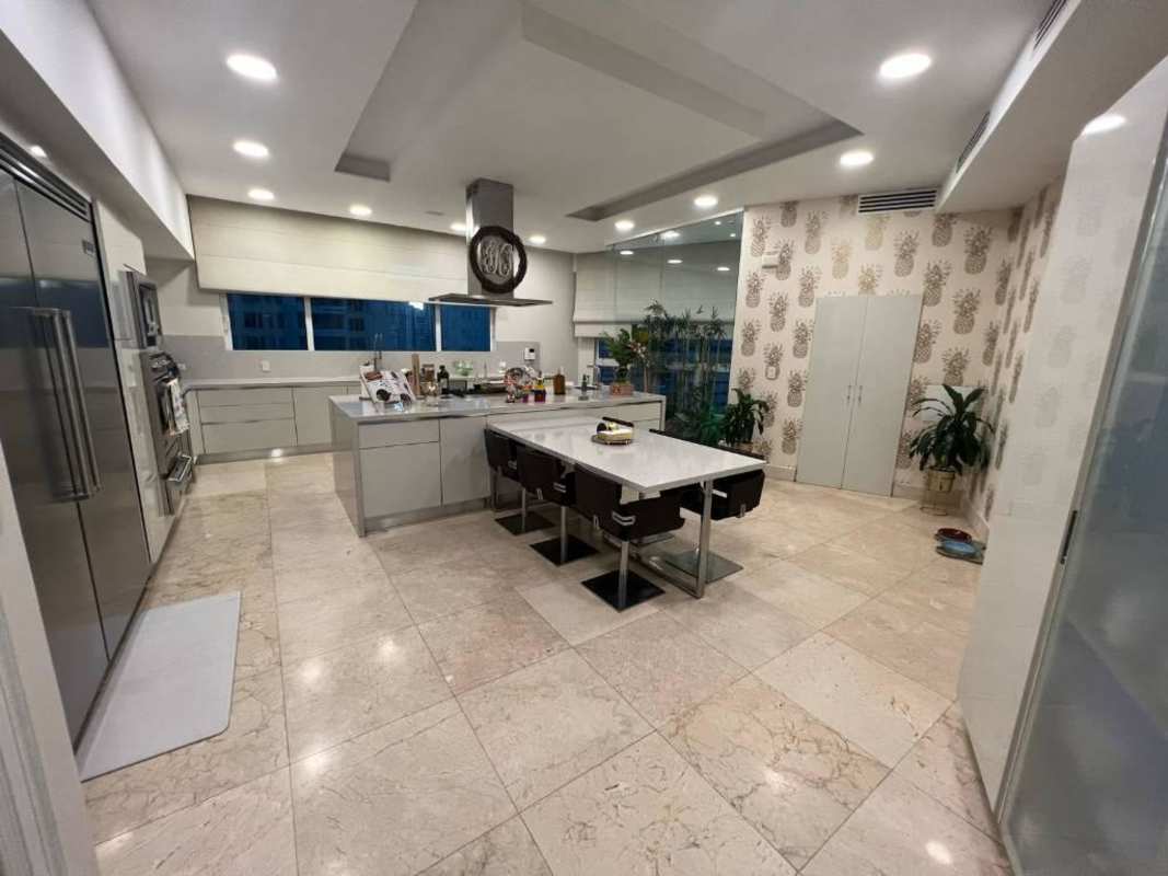 Spacious gourmet kitchen with island, stainless appliances, marble finish in PH Venetian Tower Panama City