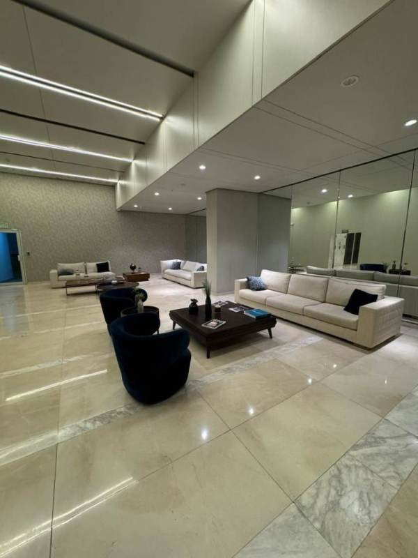 Elegant lobby with water feature, marble floors, textured walls in PH Lumiere Costa del Este Panama City Panama