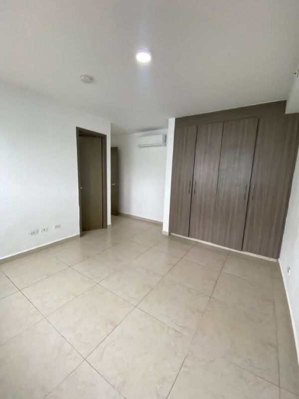 Bright bedroom space with large wardobe split AC neutral tiles PH Lumiere Panama