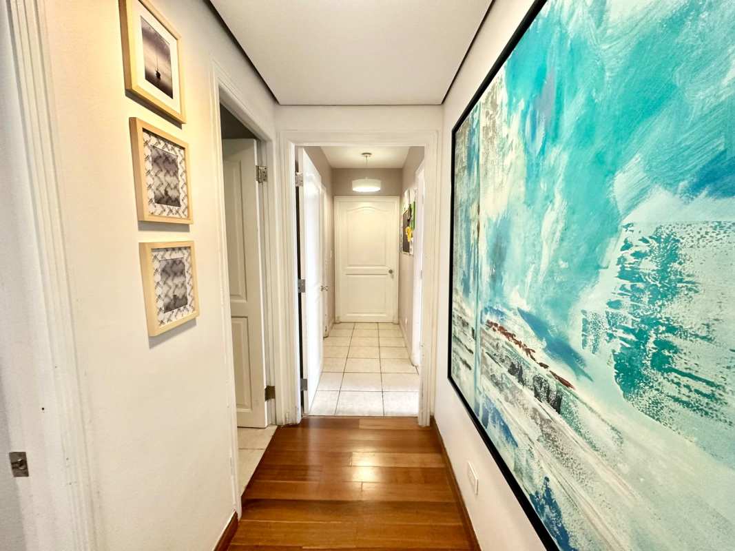 Hallway with art wood floor leading to bedrooms in PH Luna del Mar Coco del Mar