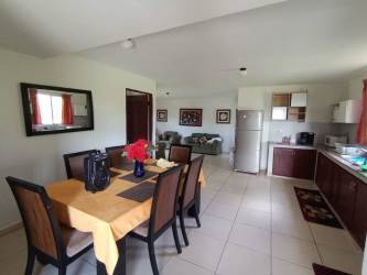 Bedroom with double bed, wardrobe, curtains, AC unit in San Miguel Bugaba furnished rental