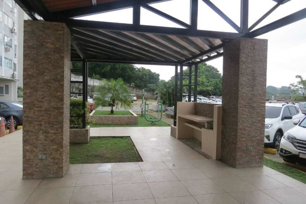 Covered communal outdoor area with gardens and benches inside PH Mystic Hills 2nd Phase Villa Lucre Panama City