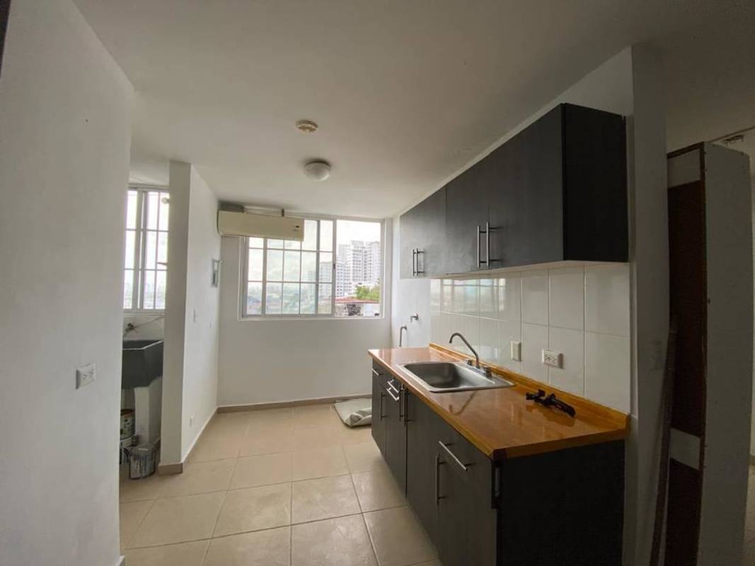 Kitchen with wooden countertop, large window, white tile backsplash at PH Mystic Hills in El Crisol Panama City Panama