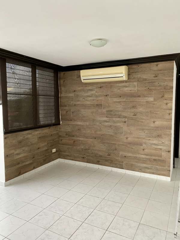 Entrance with black door, white tile floor, access to living room PH Plaza Dos Mares Panama