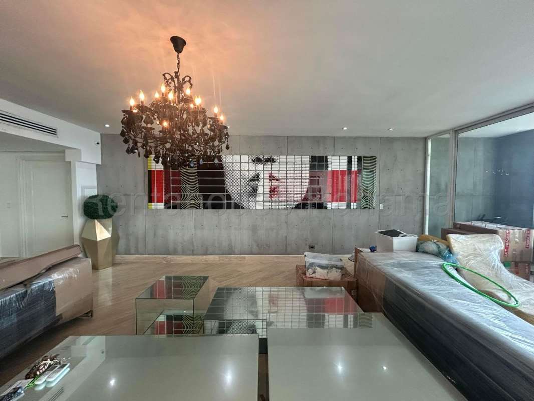 Modern luxury living room with panoramic windows, ocean view, marble floor at PH Paitilla Tower Panama