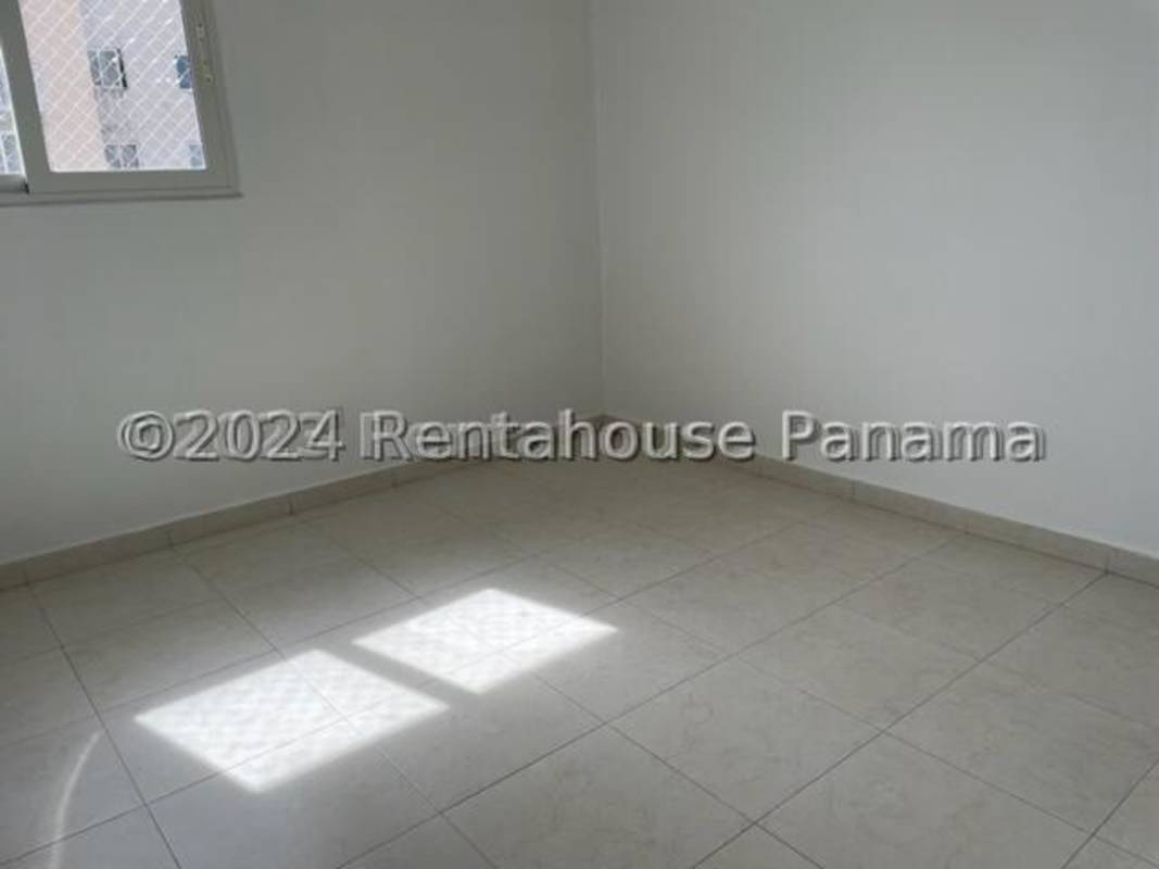 Kitchen with cabinets and ceramic flooring in Torres de Versalles apartment Panama City