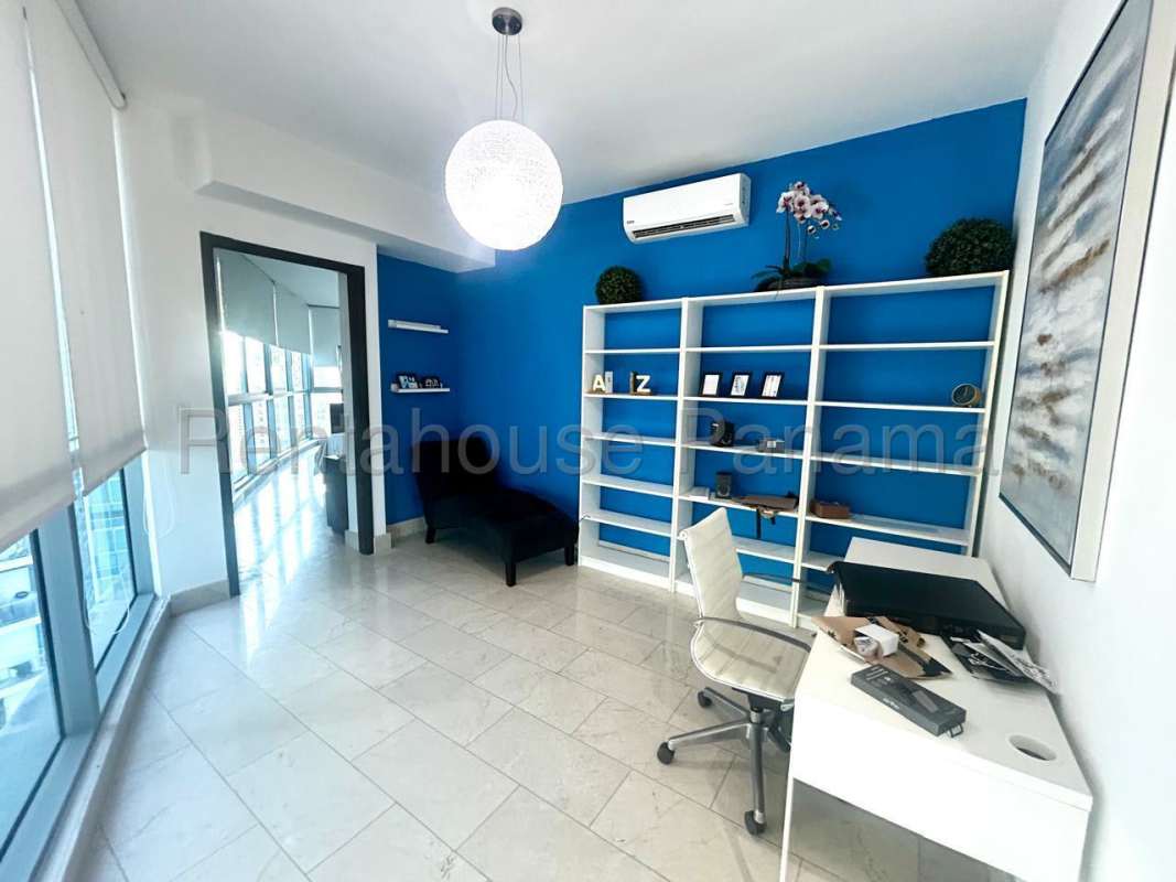 Spacious master bedroom with floor-to-ceiling windows and ocean view in Grand Tower Panama