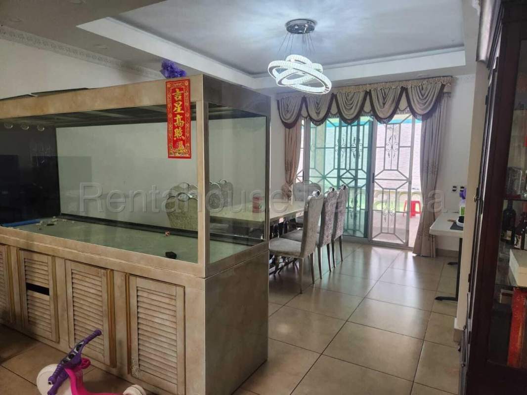 Dining area with aquarium and sliding glass doors Dorado Village Condado del Rey Panama