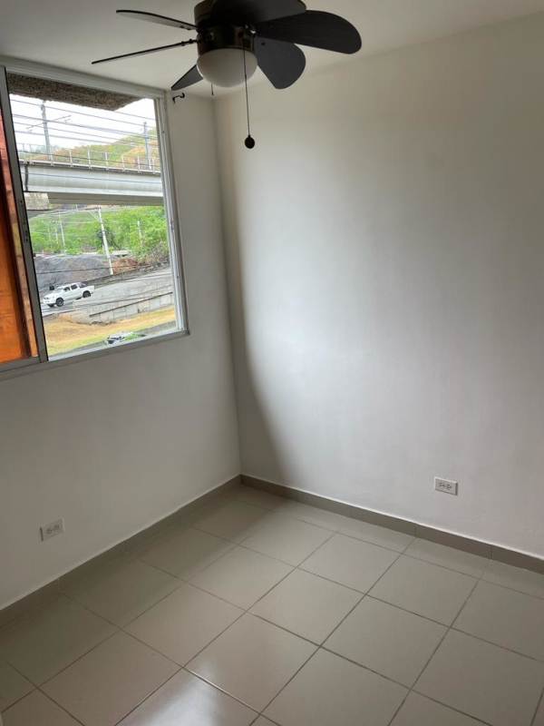 Spacious living room with window access to balcony, tiled flooring PH Mallorca Park Los Andes Panama
