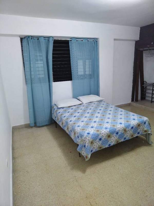 Unfurnished bedroom with tiled floors across from University of Panama