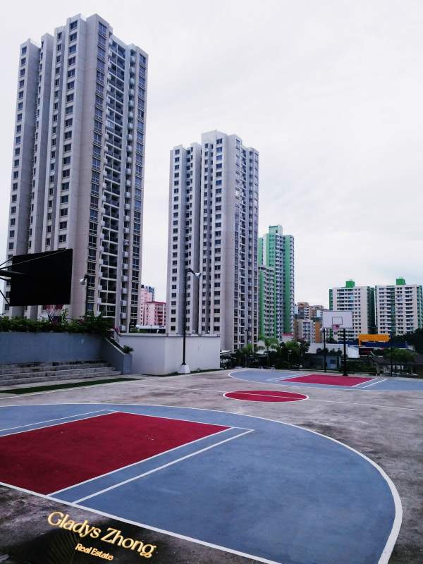 Basketball courts surrounded by high-rise towers PH Rokas Condado del Rey, Panama