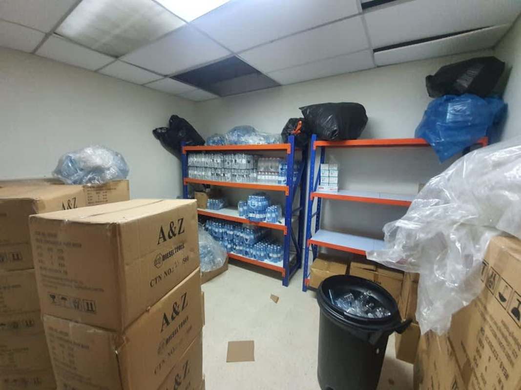Commercial storage room with metal shelving and supplies inside Hato Pintado Plaza