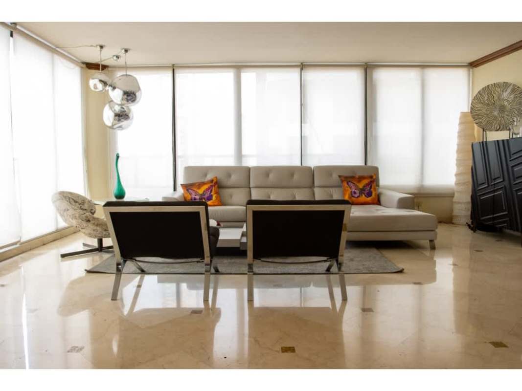 Formal dining area with large windows and terrace access at Condesa del Mar Panama City