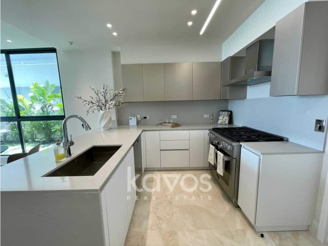 Spacious master bedroom with floor-to-ceiling windows and garden marina view at Ocean Reef Island Panama