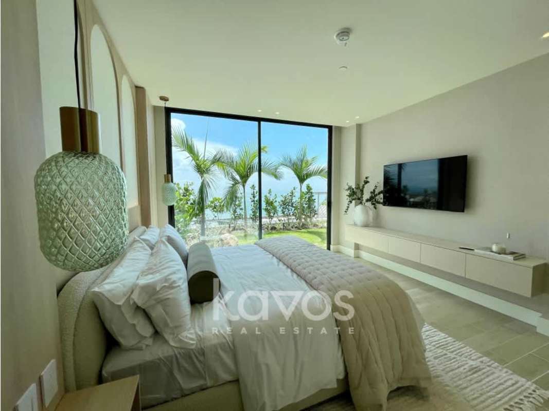 Bedroom with large windows and natural light in luxury ground floor condo Ocean Reef Island Panama