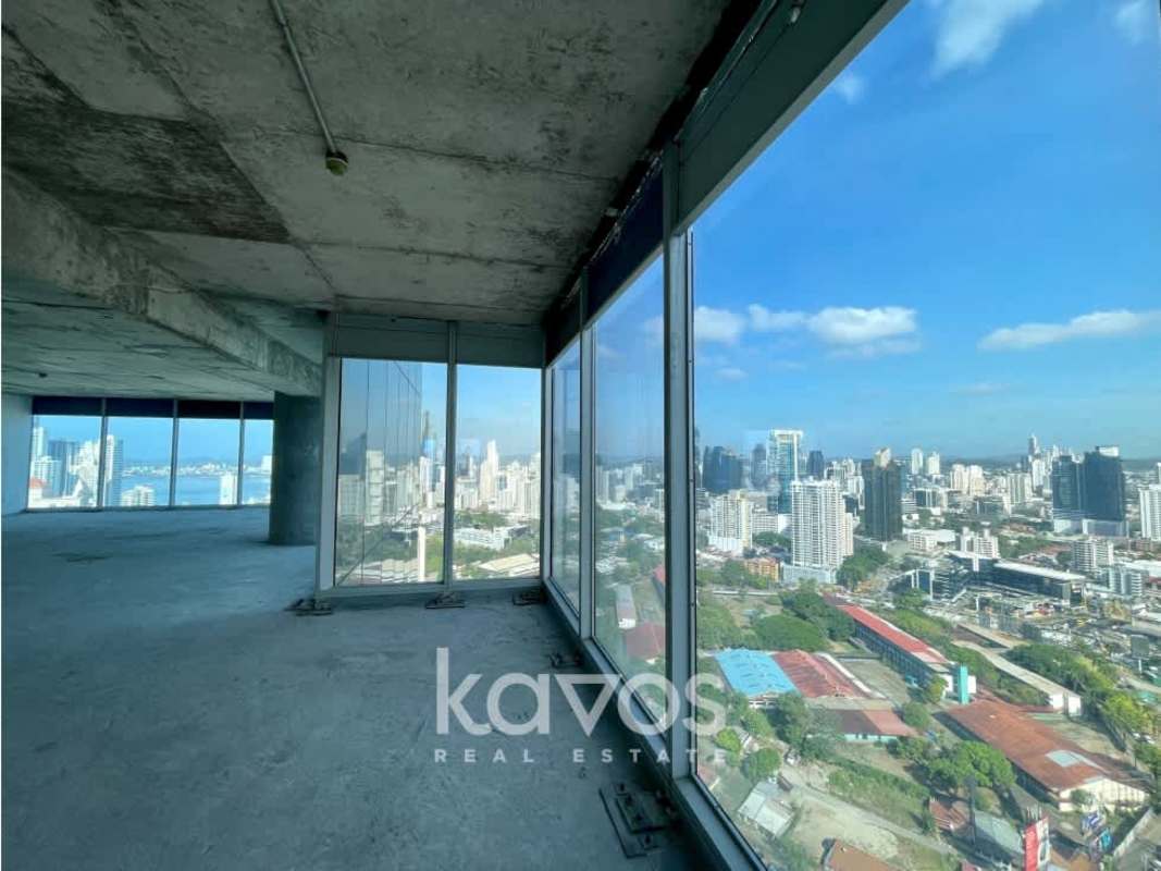 Unfinished high-floor office with panoramic city and sea views through large windows in Oceania Business Plaza Panama