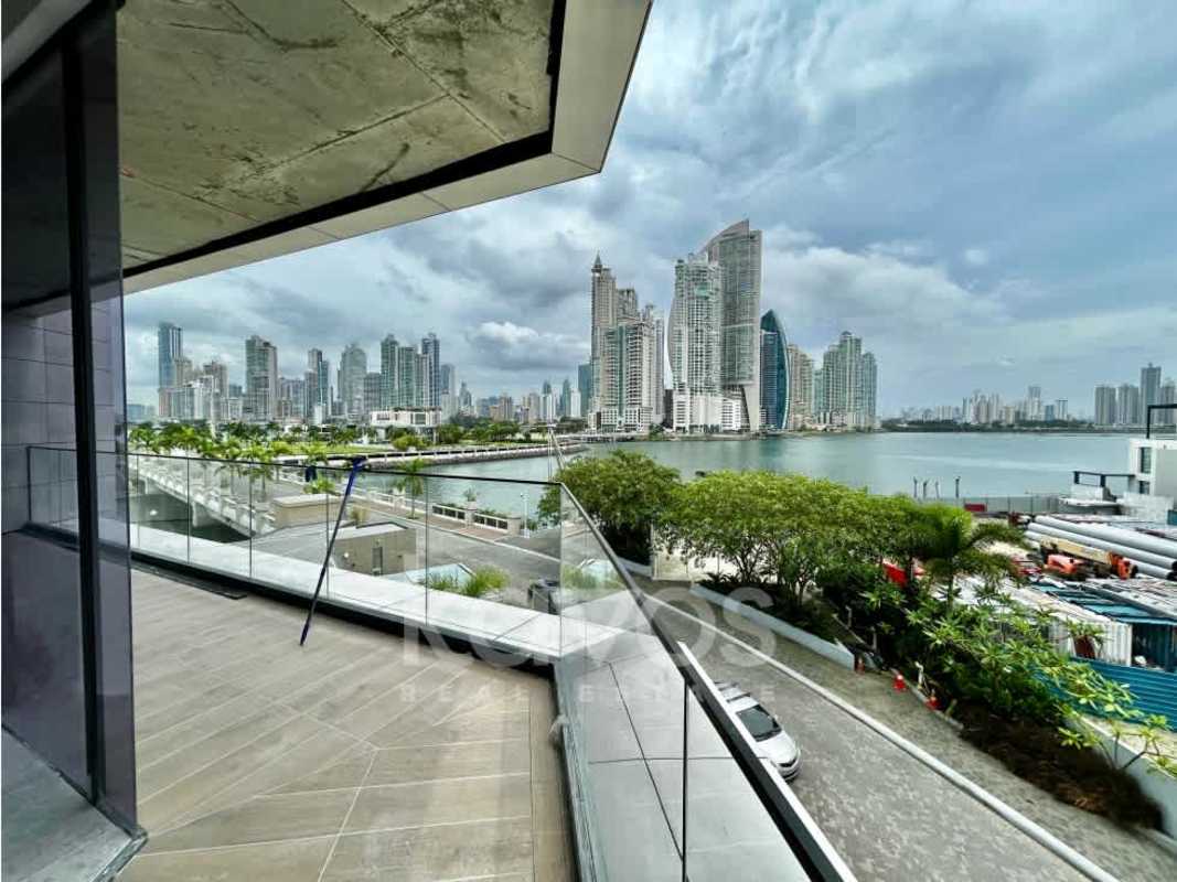 Modern panoramic terrace balcony with glass railing overlooking marina and city skyline Ocean Reef Panama