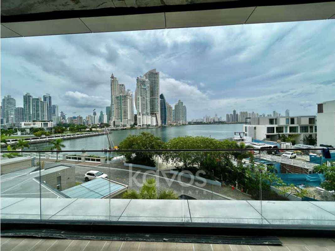 Bright open residential space with floor-to-ceiling windows panoramic ocean marina views Ocean Reef Panama