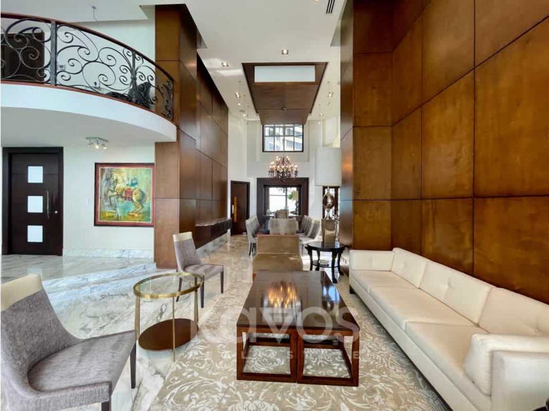 Elegant living room with marble floors floor-to-ceiling windows ocean view in The Regent Punta Paitilla