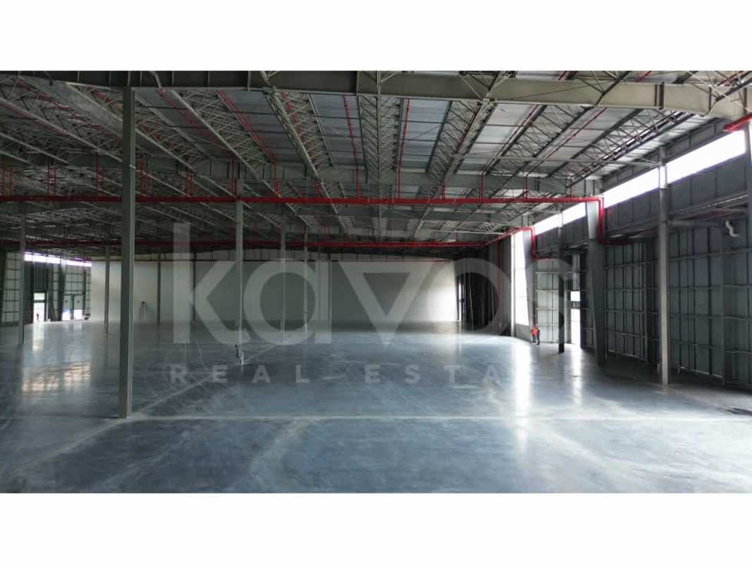 Modern new warehouse facade at Panama industrial complex, ample truck access