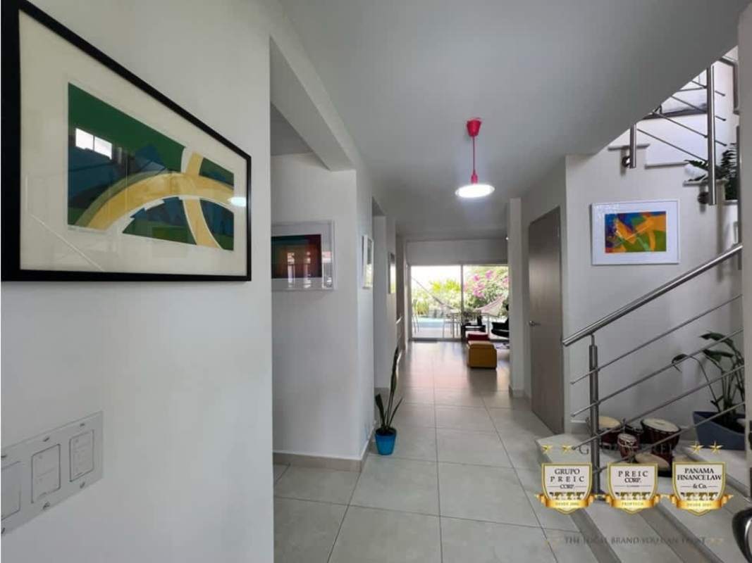 Open hallway with staircase and natural light corner house Costa Sur Panama
