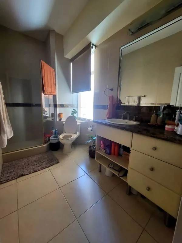 Modern bathroom with glass shower enclosure and vanity in PH Vista del Mar Panama