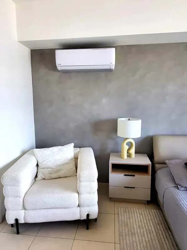 Contemporary kitchen with marble countertop breakfast bar at PH Vista del Mar Panama