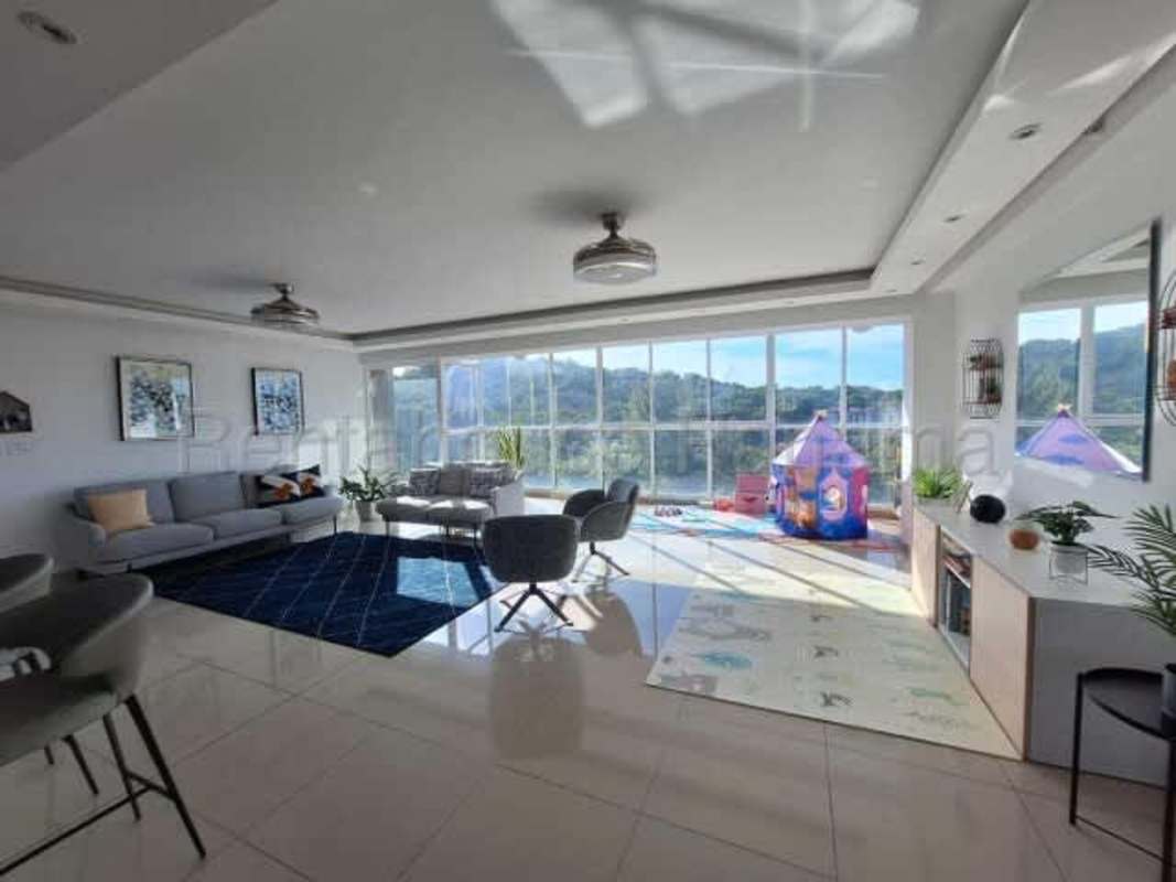 Modern open plan living dining room with city and mountain views