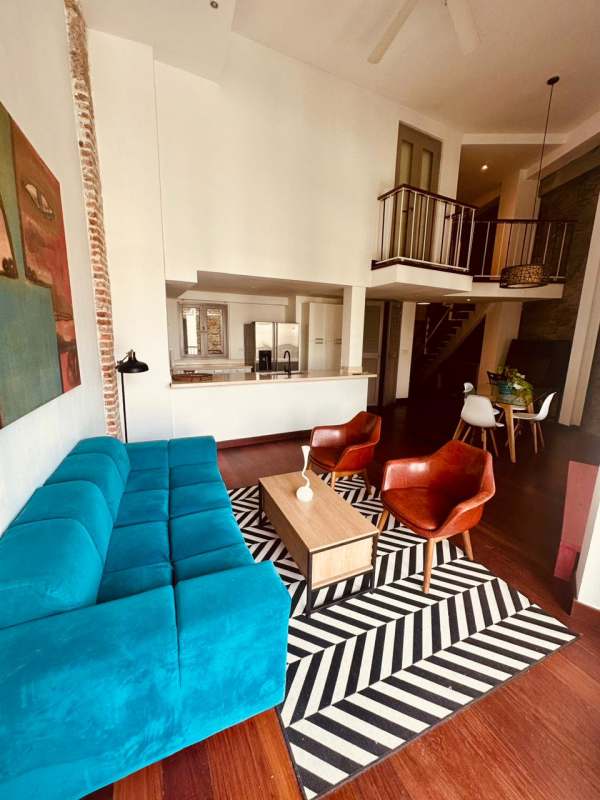 Modern open concept living dining with exposed brick accent in PH Jerónimo Casco Viejo Panama for rent