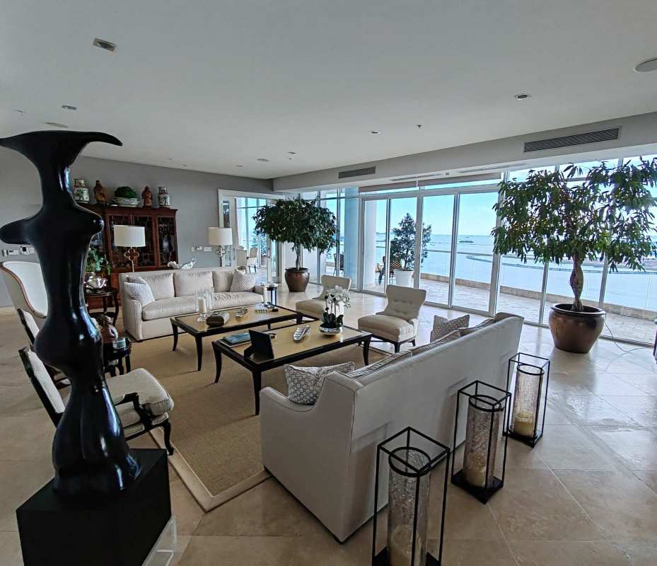 Formal living area with floor-to-ceiling windows and panoramic views in Punta Paitilla luxury penthouse Panama City