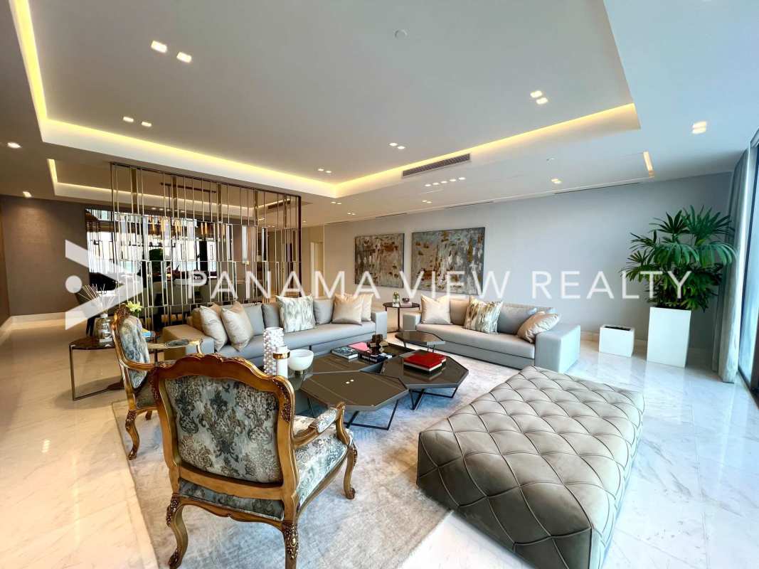 Modern dining room with glass table marble floors ocean view PH The Residences Punta Pacifica