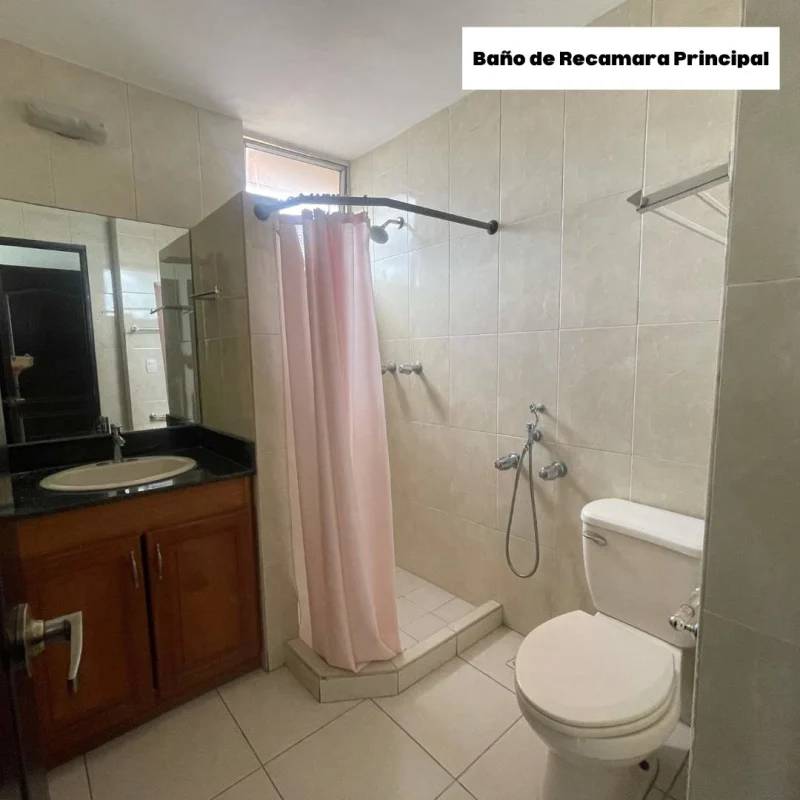 Secondary bathroom with shower enclosure, mirror and tiled walls in PH Torre Porras Via Porras Panama