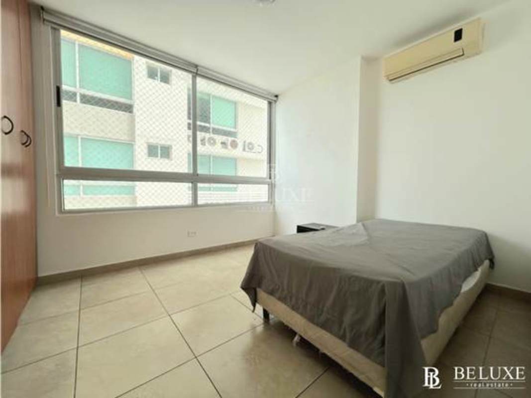 Spacious master bedroom with ocean view window in PH Terrasol Panama