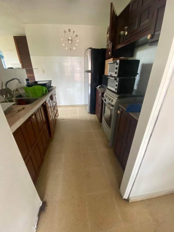 Kitchen with wood cabinets appliances double sink Bella Vista Tower Panama