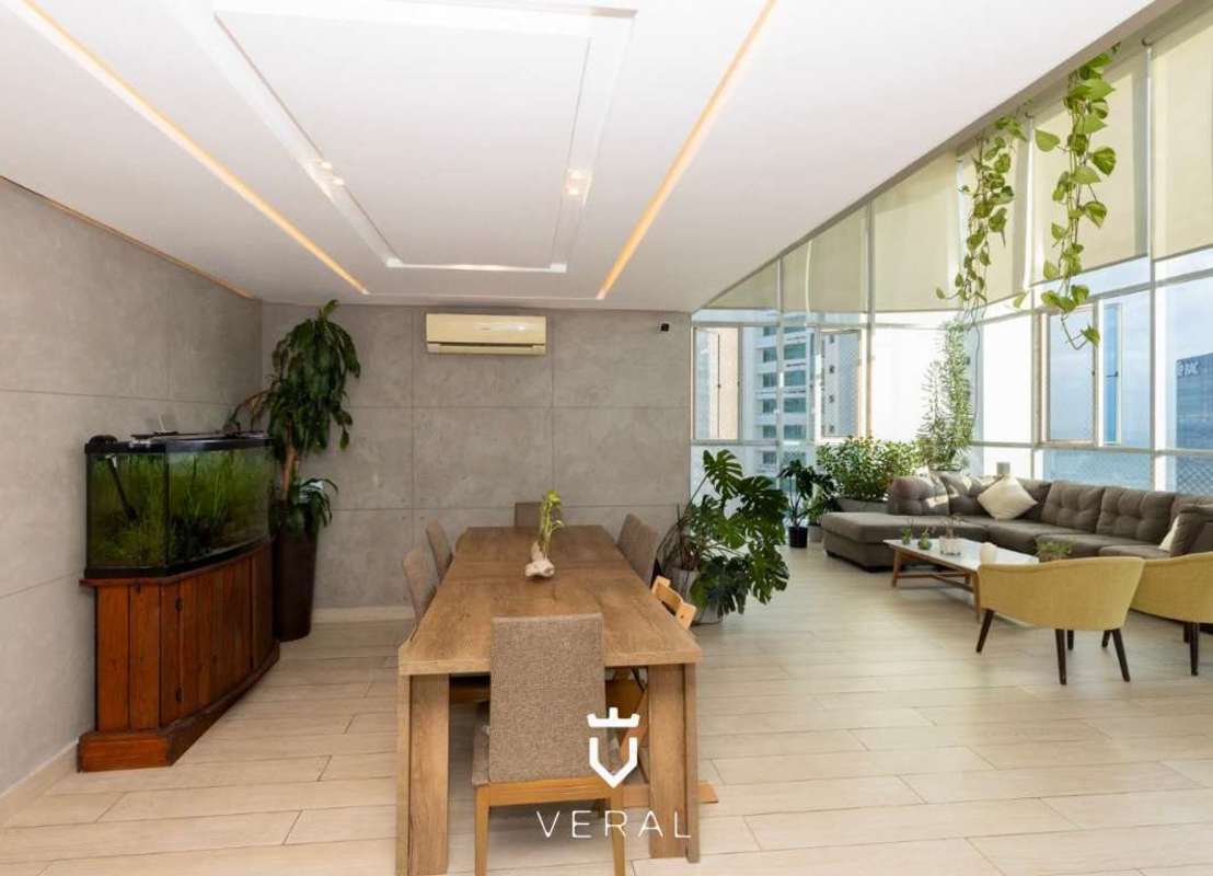 Open plan dining and living room with full height windows, city views at PH Blue Park Bella Vista