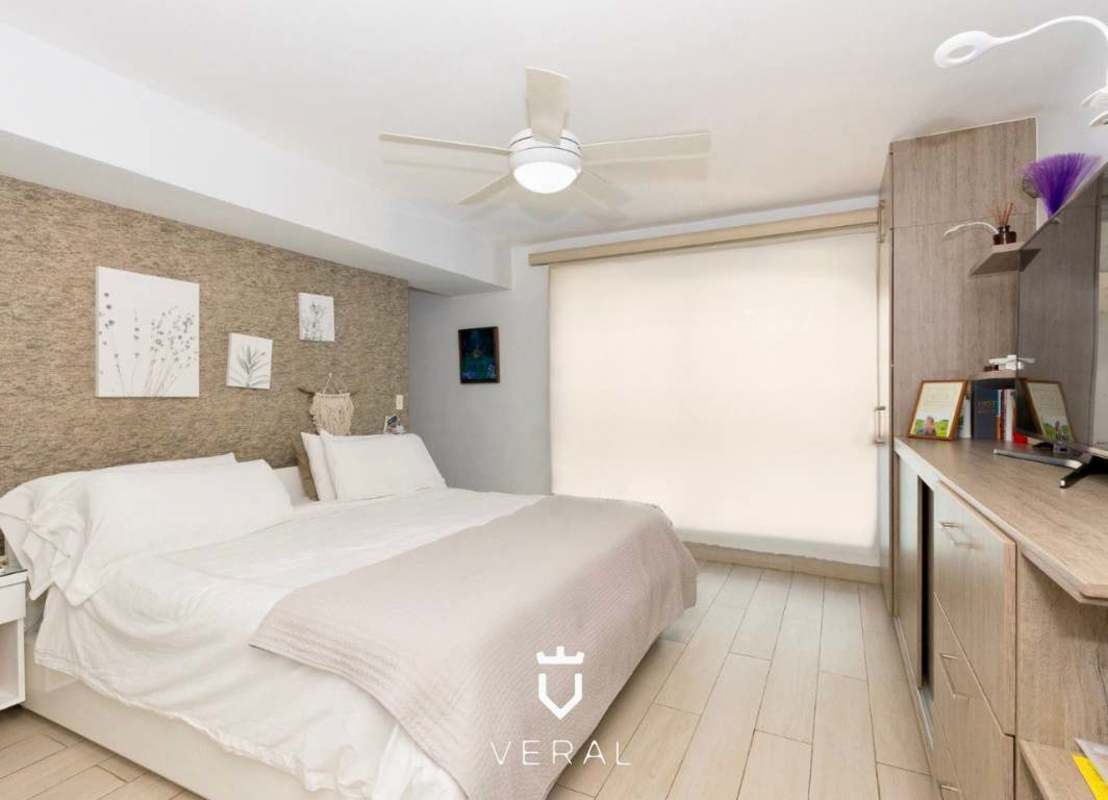 Open living dining area with large windows overlooking city and ocean PH Blue Park Bella Vista Panama City