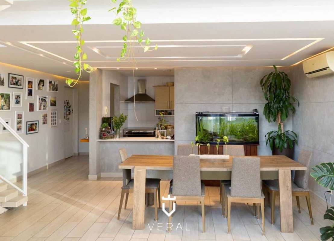 Contemporary living room with large windows, high ceiling, plants, and urban views in PH Blue Park Bella Vista