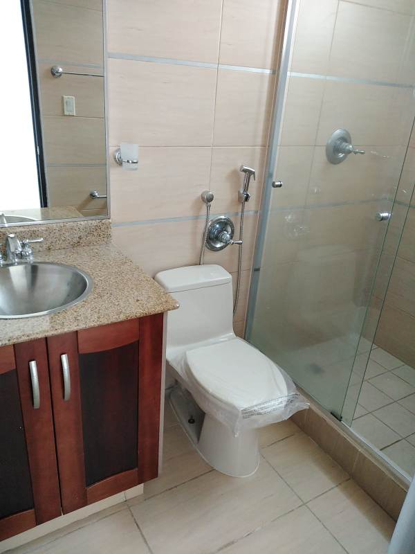 Spacious living room tiled floor large window balcony access PH Ocean Drive