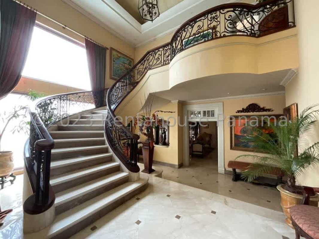 Spacious elegant living and dining with marble floors, columns, chandelier in El Carmen Panama