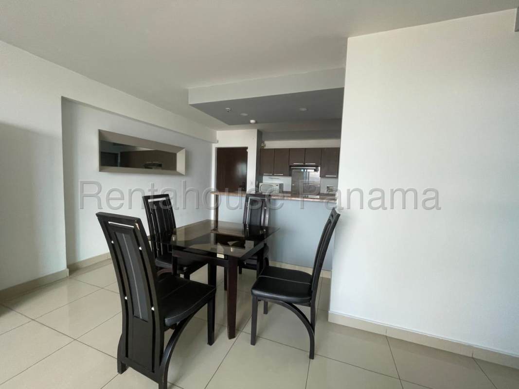 Dining space next to open kitchen with granite counters in PH Costa del Este Panama City