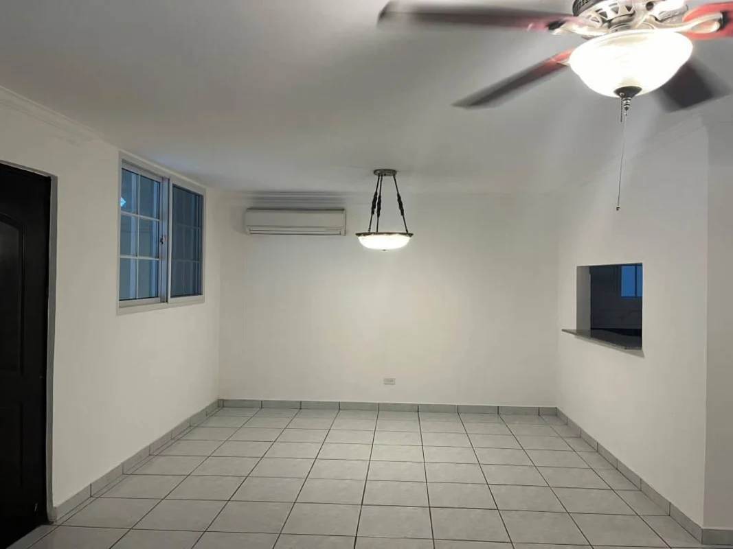 Kitchen with granite counters, double sink, dark cabinetry, white tile backsplash PH Torres de Toscana Panama