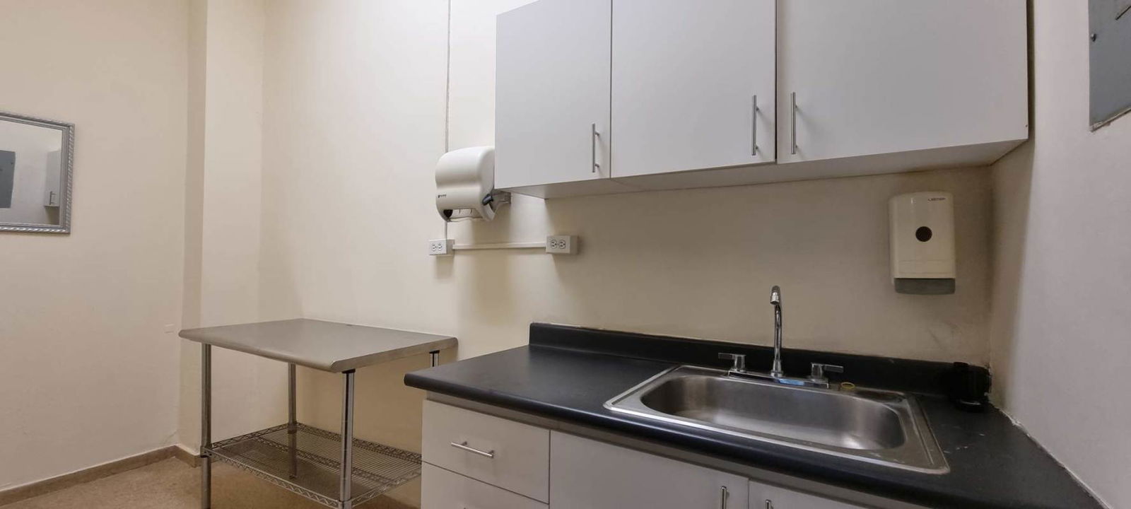 Office kitchenette with sink and cabinets in commercial rental San Fernando Center Panama