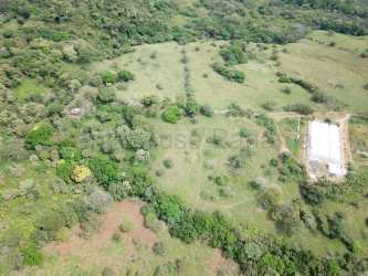 Panoramic countryside farmland with greenhouses and mountain views for sale in Chame Panama