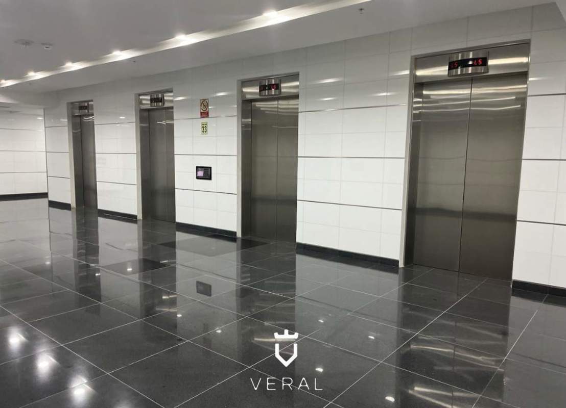 Lobby with multiple stainless steel elevators in Ocean Business Plaza Tower Banesco Marbella Panama City