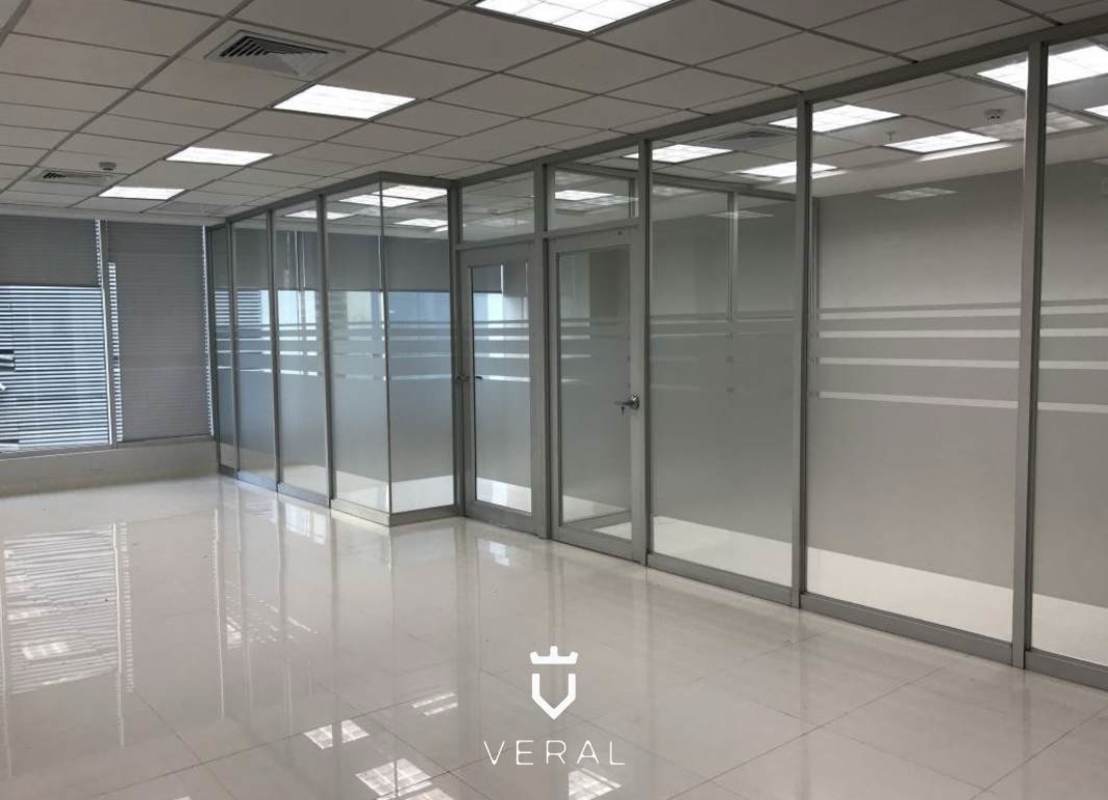 Modern empty corporate office glass partitions tiled floors Ocean Business Plaza Marbella Panama